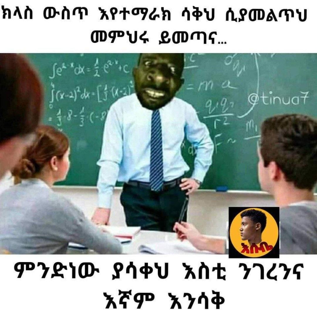 a man in a mask is sitting at a desk